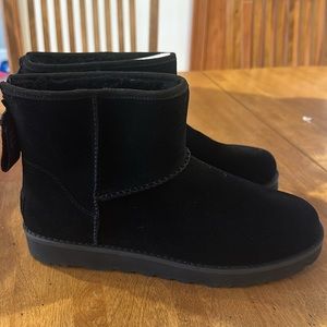 Ugg mini boots size 10.  Black - never worn